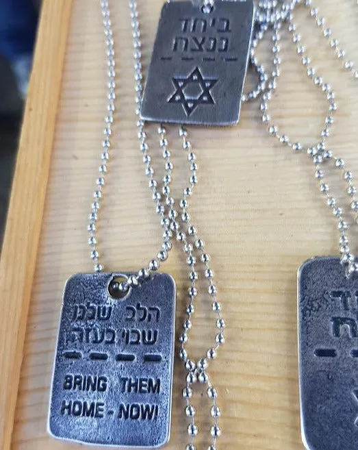 bring them home dog tags gold silver. Disc tags  dog tag to remind the kidnapped citizens  in Gaza. Bring them Back.