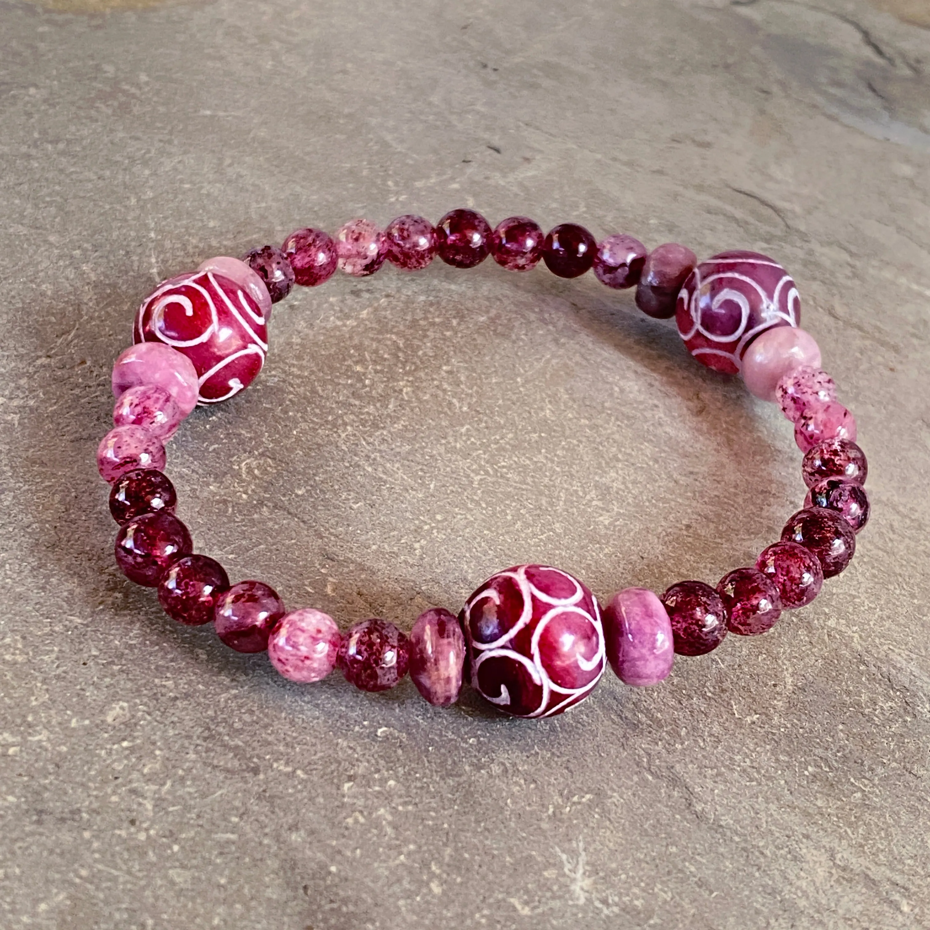 Red Jade, pink tourmaline, and strawberry Lepidocrocite gemstone stretch bracelet